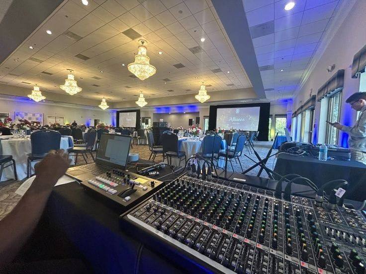 Audio mixing console at the front-of-house desk of a banquet event